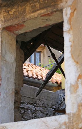 Looking through window on old abandoned house.