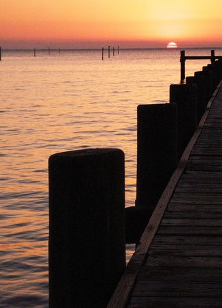 Watching the sun set on the dock of the bay.の写真素材
