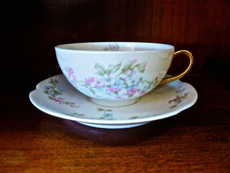 An antique teacup and saucer.の写真素材