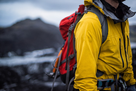 Hiker with a yellow jacket.