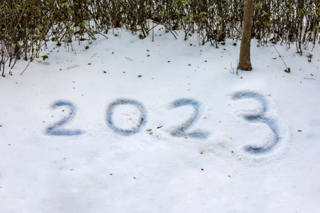 Written as 2023 on the snow covered groundの写真素材