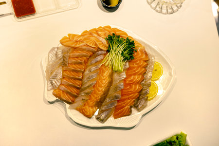 Salmon and raw fishes on the plate