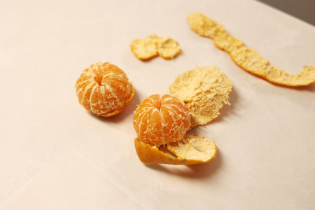 Peeled tangerines on the tableの写真素材