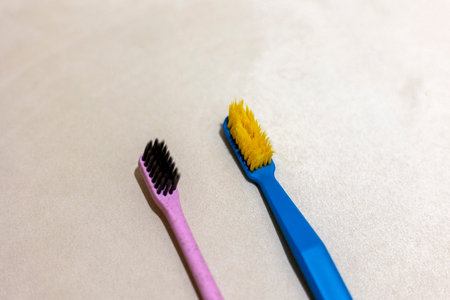 New toothbrush and old toothbrush in bathroomの写真素材