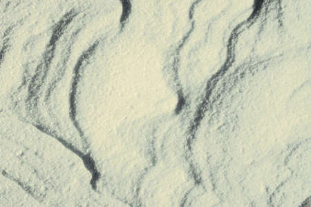 Snow shapes. Waves in the snow. Winter scenery. Winter backgroundの写真素材