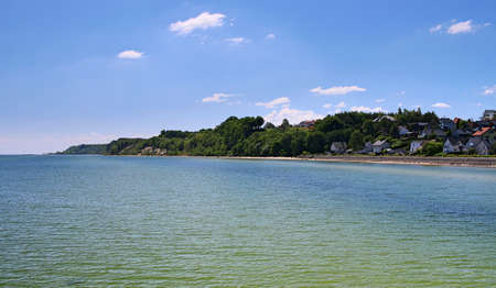 View from the Baltic Sea on the coast and the beach in Mechelinki in Pomerania.の写真素材
