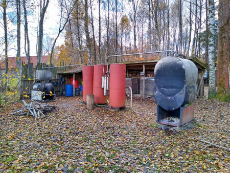 Forest moonshine plant in Podlasie. Apparatus for the production of alcohol. Distillery and tanks. Illicit alcohol productionの写真素材