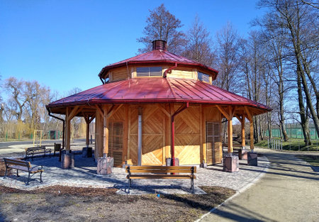 A wooden graduation tower in the park in Suprasl. March 2022, Suprasl, Polandのeditorial素材