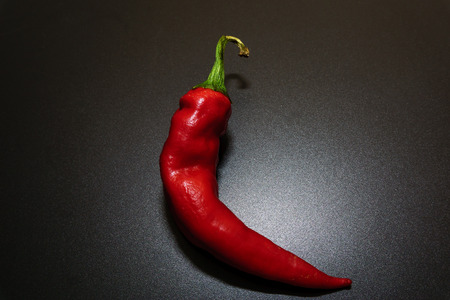 Red Chilli peppers with isolated by black background.