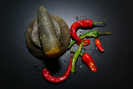 Red and Green Hot Chilli peppers with isolated by black background.の写真素材