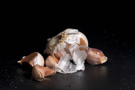 Fragrant garlic isolated with black backgroundの写真素材