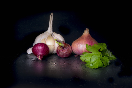 fresh Onion and garlic  isolated on Black background (onion)の写真素材