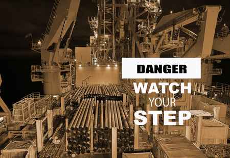 Danger sign warning you to watch your step. This simple sign is used to enforce health and safety standards.の写真素材