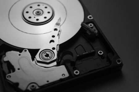 Close up of hard disk's internal mechanism hardware. Soft focus at middle and background.の写真素材