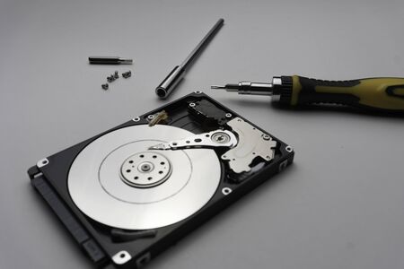 Close up of hard disk's internal mechanism hardware. Soft focus at middle and background.の写真素材
