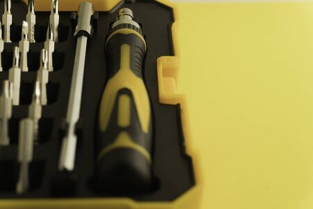 Interchangeable screwdriver set with different types of metal steel heads and bits. Isolated on white background.の写真素材
