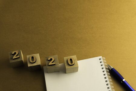 Happy New Year 2020. Symbol from number 2020 on brown background