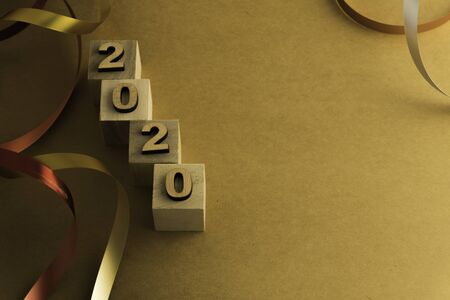 Happy New Year 2020. Symbol from number 2020 on brown background