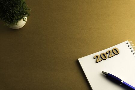 Happy New Year 2020. Symbol from number 2020 on brown backgroundの写真素材