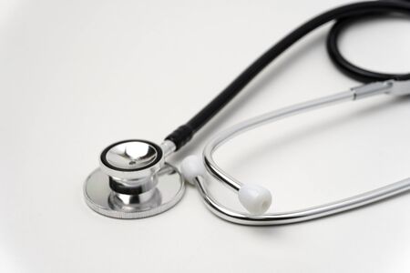 Medical, medicine stethoscope and pills on blue background. Health care or illness. Tablet or drug in hospital or pharmacy. Cardiology heart treatment. Medication prescriptionの写真素材