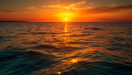 Vibrant sunset over tranquil water, reflecting beauty in nature landscape generated by artificial intelligenceの素材