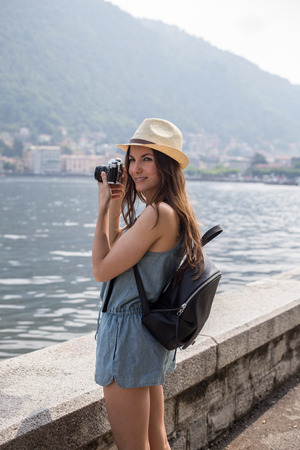 Attractive girl taking photos, girl travelling, summer dayの写真素材