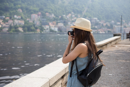 Attractive girl taking photos, girl travelling, summer dayの写真素材