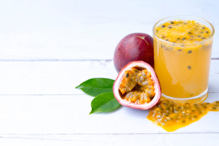 fresh passion fruit  juice smoothies isolated on white wooden background, Healthy drink concept,...