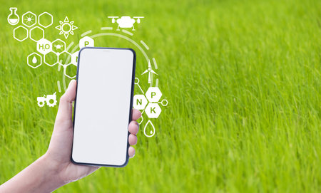 Smart farmer concept using smartphone in rice field and visual icon with modern technology...