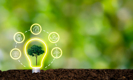 Lightbulb with small growing seedlings on soil  with technology icons  energy sources for renewable,...