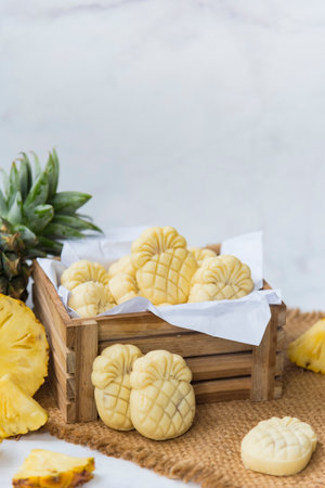 Homemade butter cookies with pineapple jam inside, Photographed with natural light. Selective Focus. White textured background.の写真素材