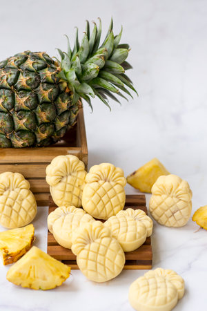 Homemade butter cookies with pineapple jam inside, Photographed with natural light. Selective Focus. White textured background.の写真素材