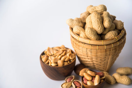 Peanuts in basket a collection of whole peanuts in their shells and a few without shells,healthy...