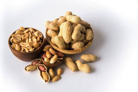 Peanuts in basket a collection of whole peanuts in their shells and a few without shells,healthy...