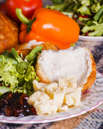 Healthly picnic lunch with vegetables and cheese in cheese ploughmans lunch bar meals in portrait fomatの写真素材