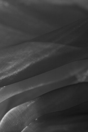 Woven Monochrome folded voile fabric backdrop  Nice textures の写真素材