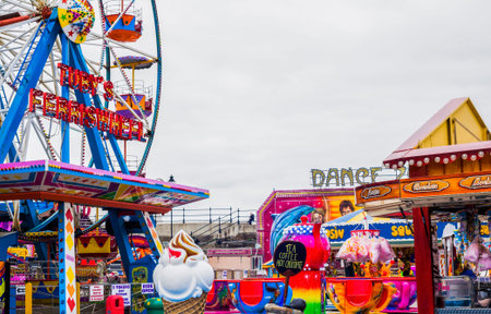 Exciting fun fair and rides at Scarborough sea front in North Yorkshire, United Kingdom for holidays and vacationsのeditorial素材