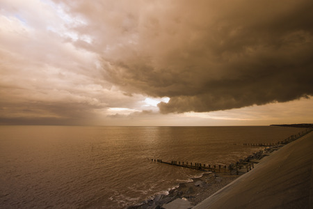 Stormy Skies over Withernsea, at sunset in East Cost Yorkshire, UKの写真素材
