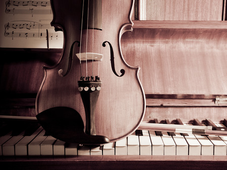 Violin with bow and flowers for concepts of music, love, romance and serenadingの写真素材
