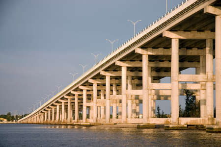 Large modern bridge or causeway illuminated by late evening sunの写真素材