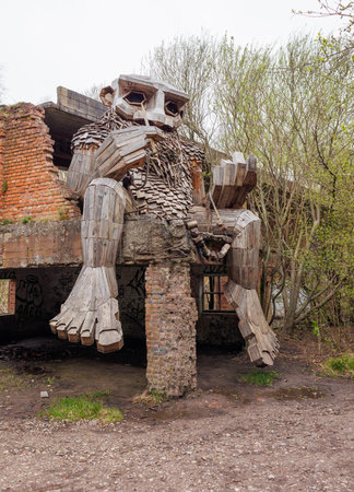 Sculpture of a man in the form of a monster in the ruins of an ancient building.の写真素材