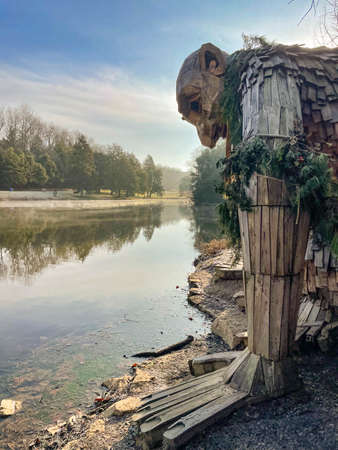 Sculpture in a wooden house on the shore of the lake.の写真素材