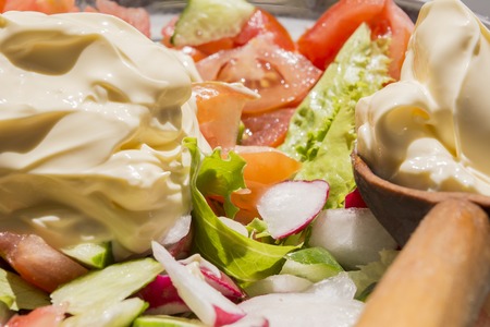 colourful spring fresh vegetable salad with vegetable gardenの写真素材