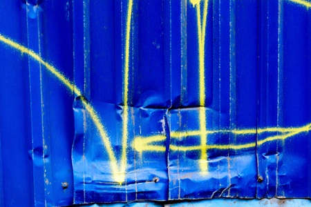 spray painted on dented, rusty highway. Dent on metal graffitiの写真素材