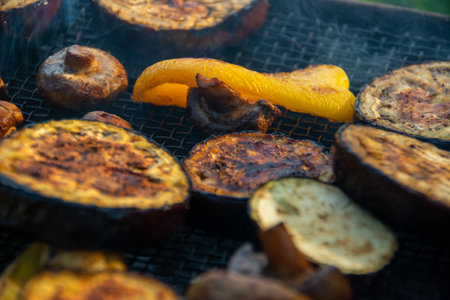 Grilled vegetables, appetizing on charcoal. Mushrooms, bell peppers and zucchini.の写真素材