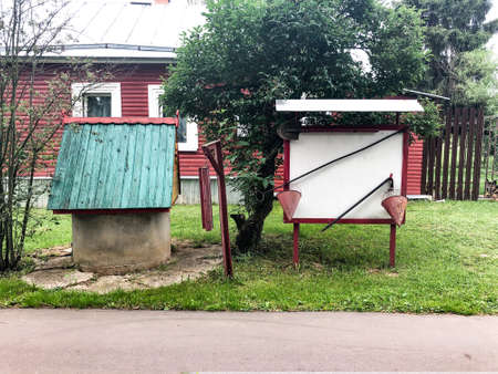 Village well, outdated fire safety system. Fire shield and tools in the villageの写真素材