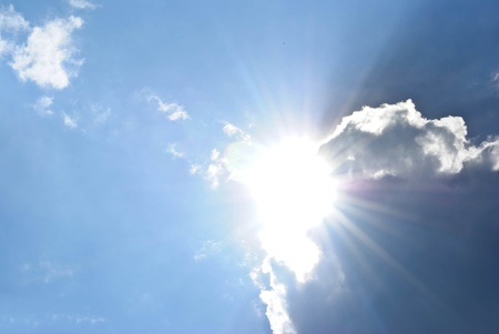 blue sky with sun and beautiful clouds の写真素材