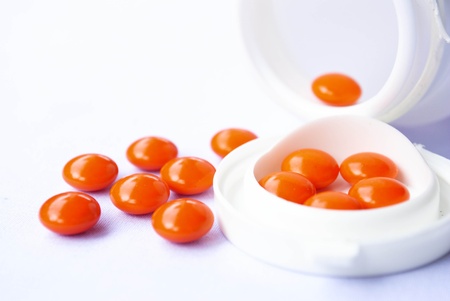 Pills pouring out of the white bottleの写真素材