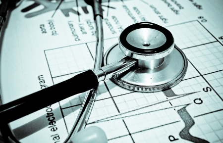stethoscope on a cardiogramの写真素材