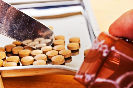 Close up of Counting tablets medical pills on stainless steel tray.(Health care and medical concept)の写真素材